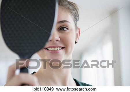 Hispanic girl admiring herself in mirror View Large Photo Image Stock Photo - Hispanic girl admiring herself in mirror. Fotosearch