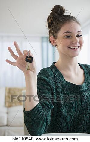 Stock Photo - Hispanic girl holding car keys. Fotosearch