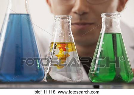 Stock Photo - Hispanic student working in chemistry lab. Fotosearch