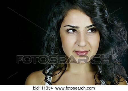 Picture - Middle Eastern woman smiling. Fotosearch