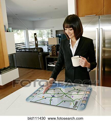 Mixed race businesswoman using computer in table View Large Photo Image Stock Image - Mixed race businesswoman using computer in table. Fotosearch
