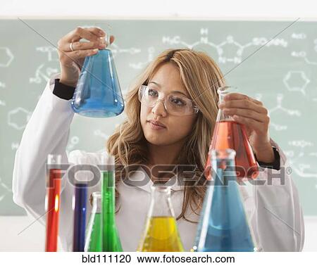 Mixed race student working in chemistry lab View Large Photo Image Stock Image - Mixed race student working in chemistry lab. Fotosearch