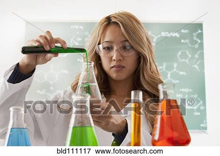 Mixed race student working in chemistry lab View Large Photo Image Stock Photo - Mixed race student working in chemistry lab. Fotosearch