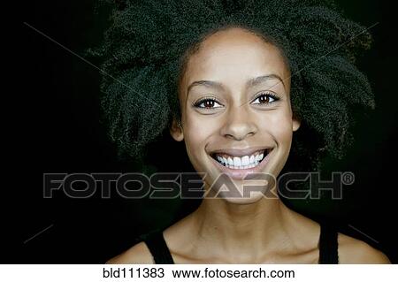 Mixed race woman smiling View Large Photo Image Stock Image - Mixed race woman smiling. Fotosearch