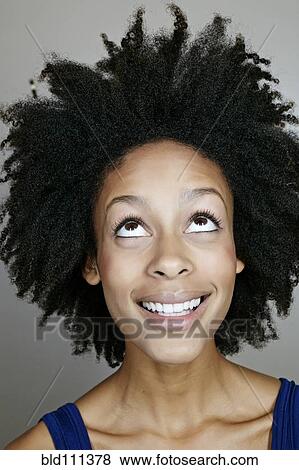 Stock Photo - Mixed race woman smiling. Fotosearch