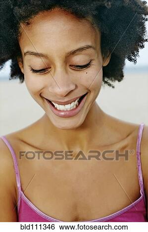 Mixed race woman smiling View Large Photo Image Stock Photograph - Mixed race woman smiling. Fotosearch