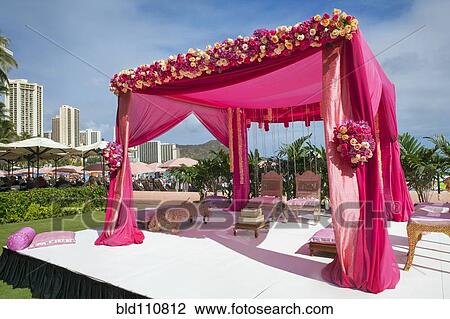 Stock Image - Pink decorations at Hindi wedding. Fotosearch