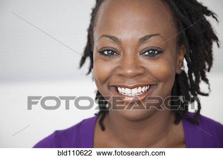 Stock Image - Smiling Black woman. Fotosearch