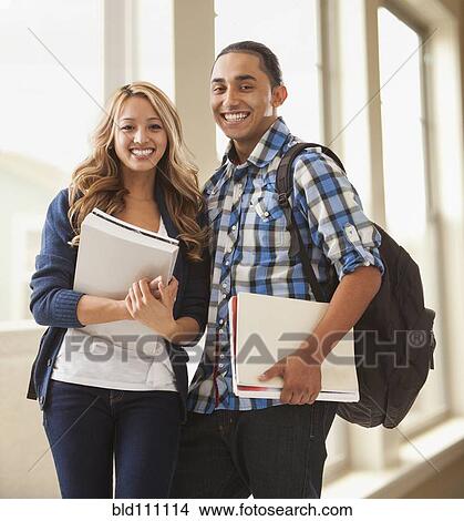 Picture - Student couple smiling on campus. Fotosearch