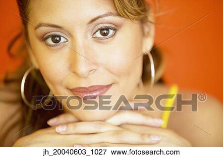 Portrait of a young woman grinning View Large Photo Image Stock Photo - Portrait of a young woman grinning. Fotosearch