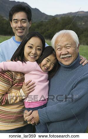 Portrait of a family smiling View Large Photo Image Stock Photo - Portrait of a family smiling. Fotosearch