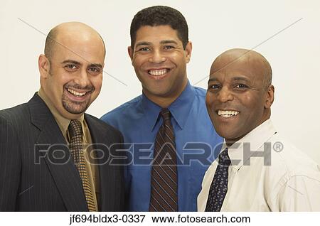 Businessmen posing for the camera View Large Photo Image Stock Photo - Businessmen posing for the camera. Fotosearch