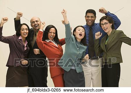 Group of business executives standing together with their arms raised in excitement View Large Photo Image Stock Photography - Group of business executives standing together with their arms raised in excitement. Fotosearch
