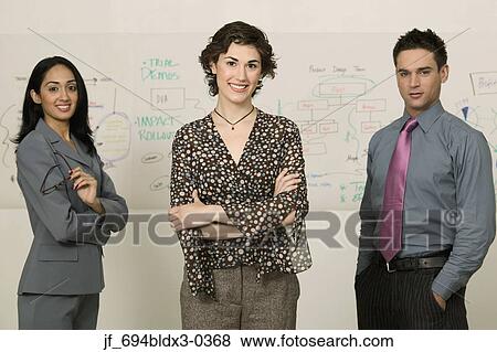 Stock Photo - Portrait of a young businesswoman looking at camera smiling. Fotosearch