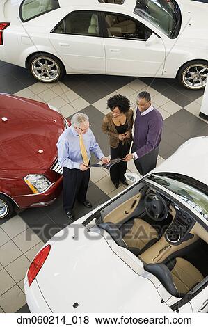 Stock Photo - Couple buying a car. Fotosearch