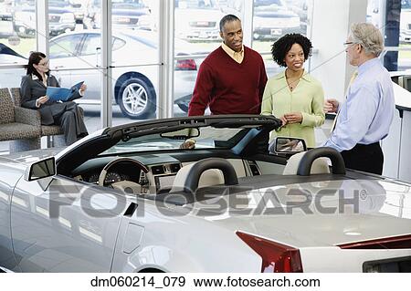 Couple buying a car View Large Photo Image Stock Photo - Couple buying a car. Fotosearch