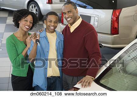 Stock Photo - Family buying a car. Fotosearch