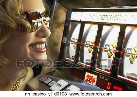 Young woman winning at the slot machine View Large Photo Image Stock Photo - Young woman winning at the slot machine. Fotosearch