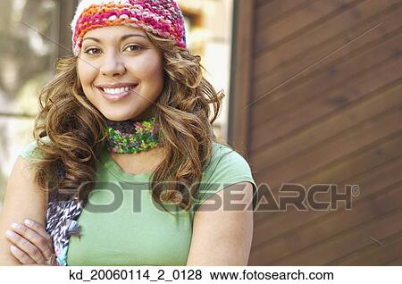 Stock Photo - Young woman smiling for the camera. Fotosearch