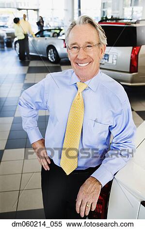 Car salesman smiling View Large Photo Image Stock Photography - Car salesman smiling. Fotosearch