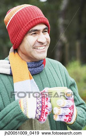 Man having a cup of coffee outdoors View Large Photo Image Stock Photo - Man having a cup of coffee outdoors. Fotosearch