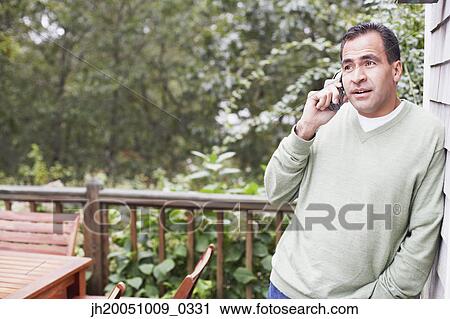 Man talking on the phone View Large Photo Image Stock Image - Man talking on the phone. Fotosearch