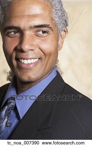 Mature businessman smiling View Large Photo Image Stock Image - Mature businessman smiling. Fotosearch