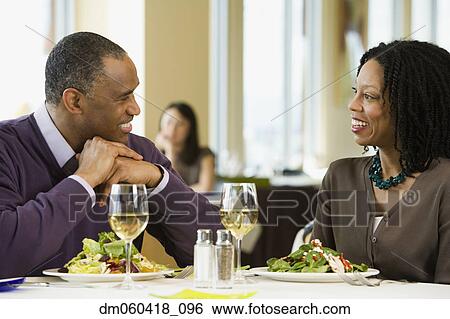 African American couple talking at restaurant View Large Photo Image Stock Photograph - African American couple talking at restaurant. Fotosearch