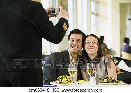 Couple having photograph taken at restaurant View Large Photo Image Stock Image - Couple having photograph taken at restaurant. Fotosearch