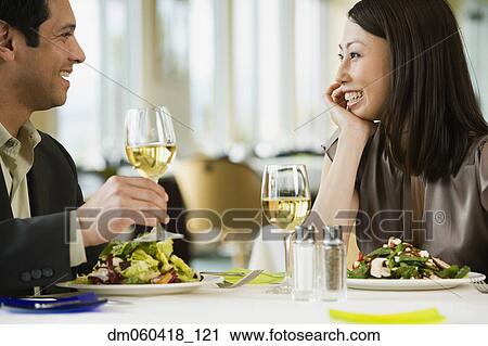 Couple talking at restaurant View Large Photo Image Stock Image - Couple talking at restaurant. Fotosearch
