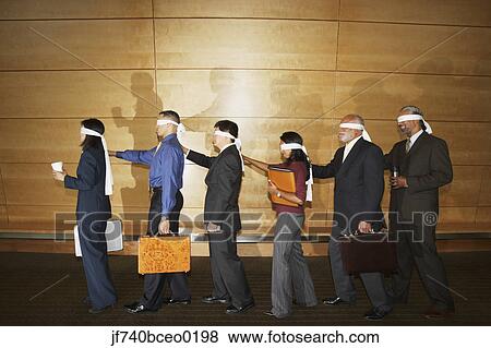 Group of co-workers doing team-building exercise View Large Photo Image Stock Photo - Group of co-workers doing team-building exercise. Fotosearch