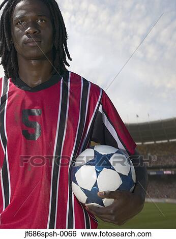 Stock Photograph - Soccer player posing for the camera. Fotosearch