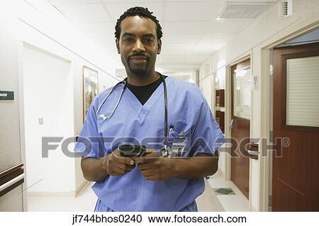 African male surgeon using electronic organizer, Bethesda, Maryland, United States View Large Photo Image Stock Image - African male surgeon using electronic organizer, Bethesda, Maryland, United States. Fotosearch