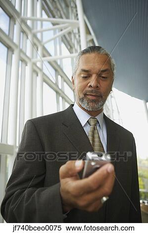 African businessman with cell phone, North Bethesda, Maryland, United States View Large Photo Image Stock Photography - African businessman with cell phone, North Bethesda, Maryland, United States. Fotosearch