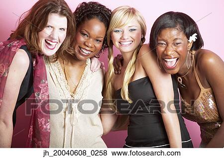 Portrait of a group of mid adult women standing together smiling View Large Photo Image Stock Photo - Portrait of a group of mid adult women standing together smiling. Fotosearch