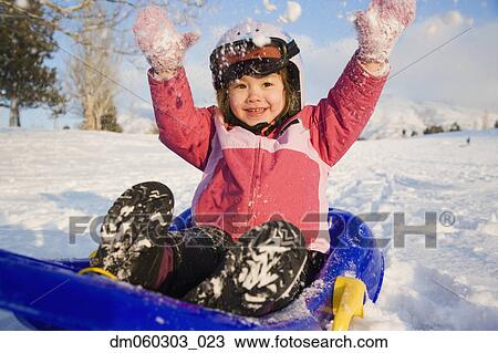 Young girl on sled in the snow, Seattle, Washington, United States View Large Photo Image Stock Image - Young girl on sled in the snow, Seattle, Washington, United States. Fotosearch
