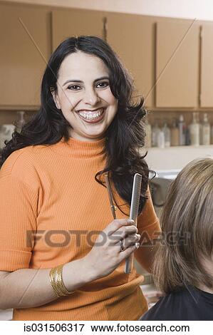 Female hairstylist in salon View Large Photo Image Stock Photo - Female hairstylist in salon. Fotosearch