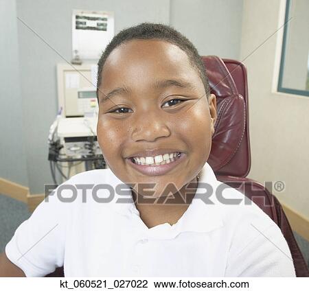 African boy smiling in dentist's chair View Large Photo Image Stock Image - African boy smiling in dentist's chair. Fotosearch
