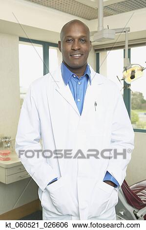 African male dentist in office View Large Photo Image Stock Photograph - African male dentist in office. Fotosearch
