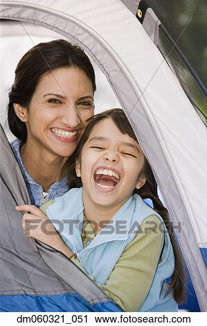 Hispanic mother and daughter laughing in tent View Large Photo Image Stock Image - Hispanic mother and daughter laughing in tent. Fotosearch