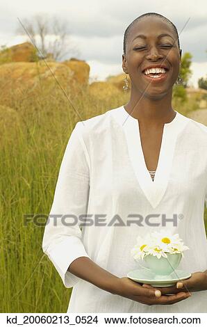 African American woman with teacup outdoors View Large Photo Image Picture - African American woman with teacup outdoors. Fotosearch