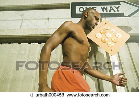 Male athlete running in urban surroundings View Large Photo Image Stock Photo - Male athlete running in urban surroundings. Fotosearch