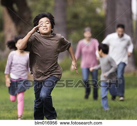 Asian family playing together outdoors View Large Photo Image Stock Photograph - Asian family playing together outdoors. Fotosearch