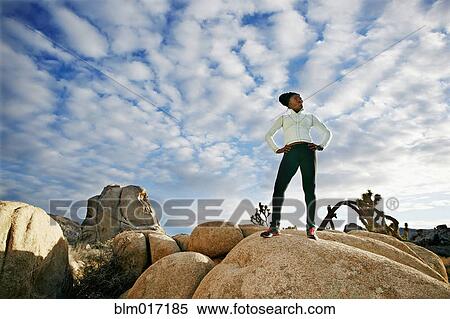 Black runner in desert landscape, Joshua Tree National Park, California, United States View Large Photo Image Stock Photography - Black runner in desert landscape, Joshua Tree National Park, California, United States. Fotosearch