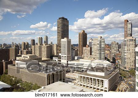 Stock Image - Blue sky and cityscape, New York, New York, United States. Fotosearch