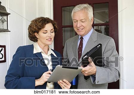 Stock Image - Business people using tablet computers. Fotosearch
