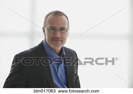 Caucasian businessman smiling View Large Photo Image Stock Image - Caucasian businessman smiling. Fotosearch