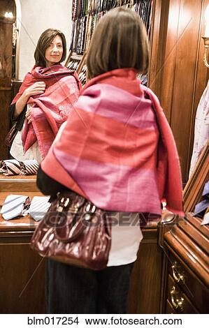 Caucasian woman shopping for scarf View Large Photo Image Picture - Caucasian woman shopping for scarf. Fotosearch