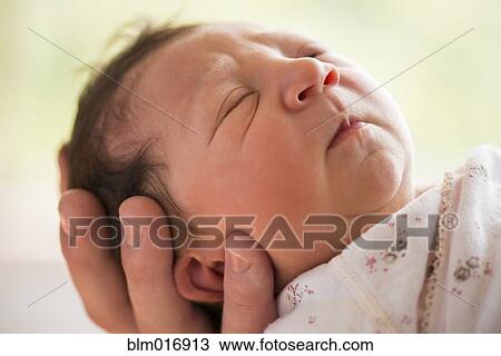 Stock Image - Close up of Caucasian infant's face. Fotosearch