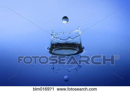 Stock Image - Close up of water droplet splashing. Fotosearch
